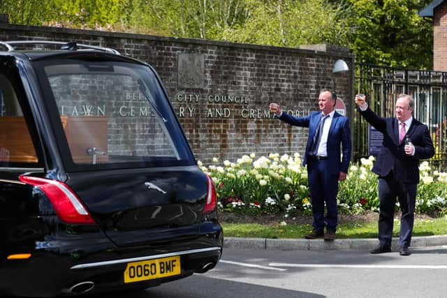 Raising a glass at BJ Hogg's funeral in May. 

Photo by Kelvin Boyes / Press Eye.