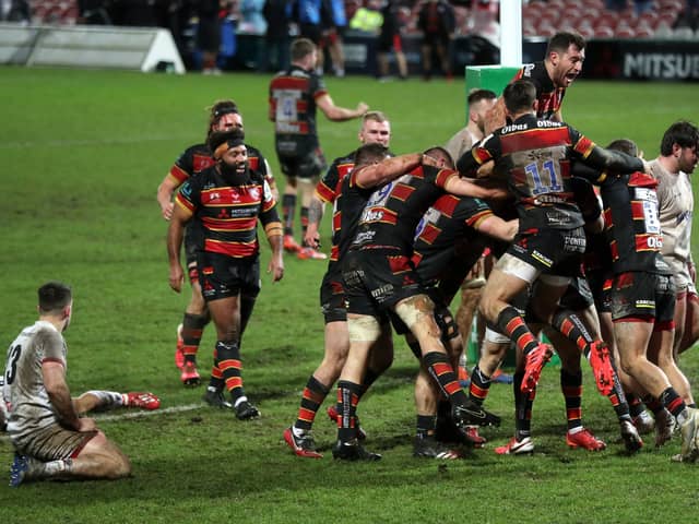 Gloucester's George Barton (hidden) celebrates scoring his side's third try of the game during the Heineken Champions Cup match at the Kingsholm Stadium, Gloucester.