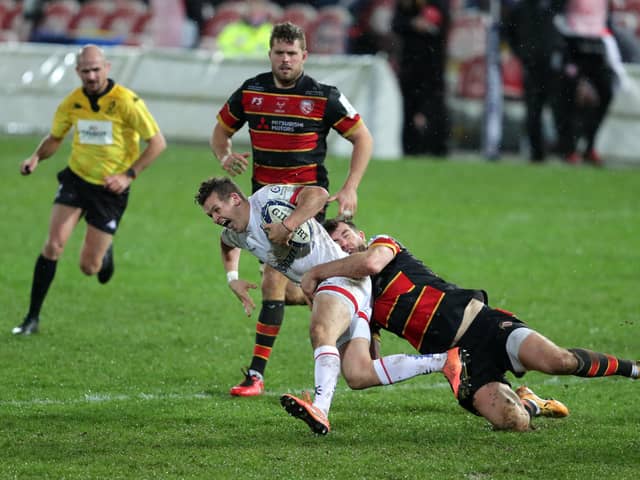 Ulster's Billy Burns is tackled by Gloucester's Mark Atkinson during the Heineken Champions Cup match at the Kingsholm Stadium, Gloucester.