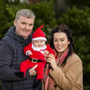 Glenn Coburn and Josey Loughran with their son, Caden James Coburn, in Wallace Park, Lisburn, who are looking forward to spending their first Christmas at home as a family.