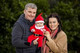Glenn Coburn and Josey Loughran with their son, Caden James Coburn, in Wallace Park, Lisburn, who are looking forward to spending their first Christmas at home as a family.