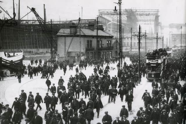 River Lagan was vital industrial artery to the world. Shipyard workers. Queens Road, 1911