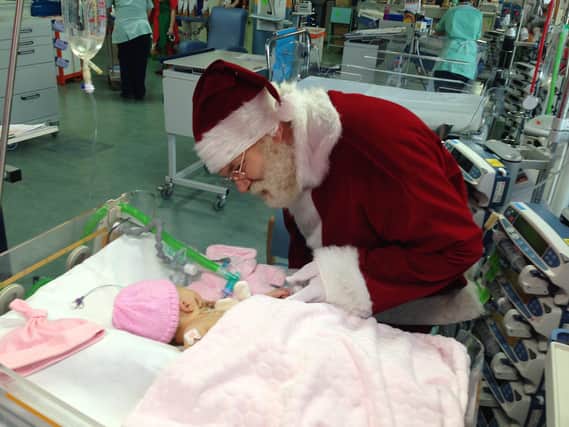 Baby Lacie receives a visit from Santa in intensive care