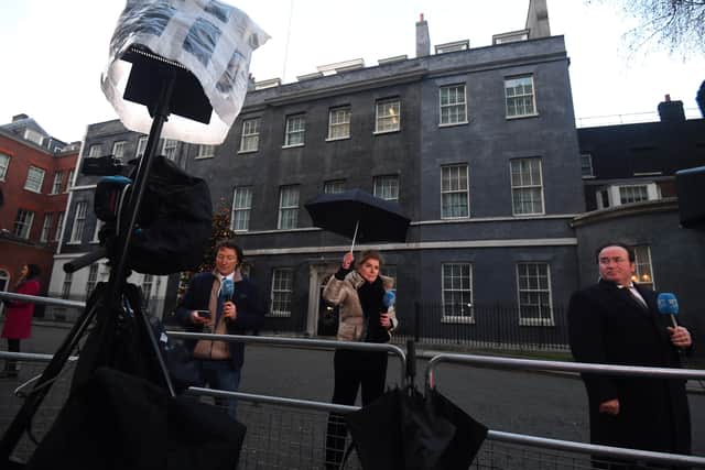 The media gathered outside 10 Downing Street, London, ahead of a briefing from Prime Minister Boris Johnson the agreement of a post-Brexit trade deal. Photo: Victoria Jones/PA Wire