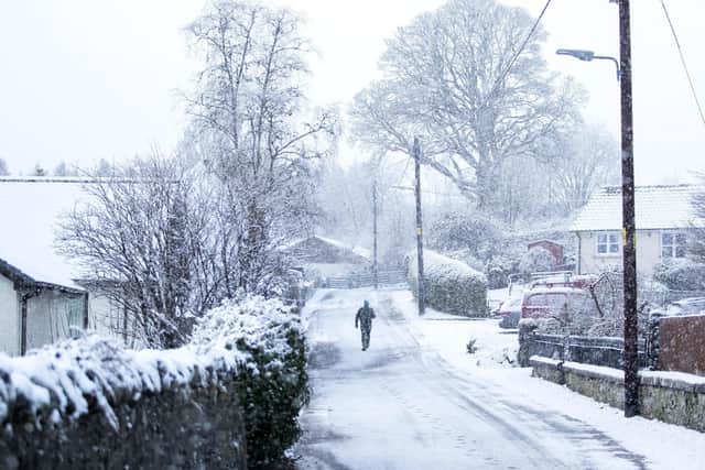 A man walks through the snow in Killin, Stirlingshire. PA image
