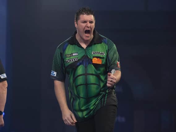 Daryl Gurney celebrates against Chris Dobey during his third round victory at the William Hill World Darts Championship.