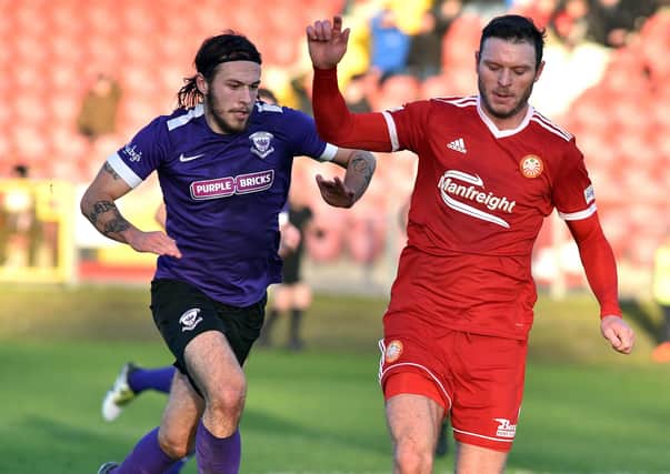Ben Tilney (left) playing for Larne against Portadown in 2018. Pic by TPX SPORT