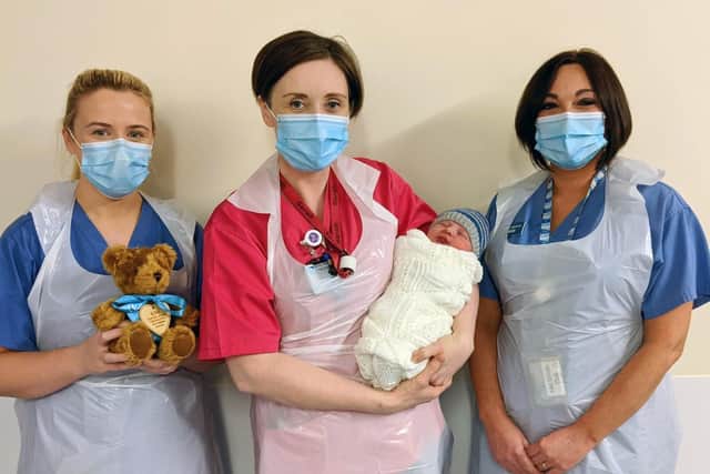 Baby boy Shanley who was born at 00:56hrs in the Royal Victoria Hospital in Belfast this morning, January 1, 2021.
Pictured with baby Shanley are, from left to right, Student Midwife Mairead Lavery, Staff Midwife Sarah Laverty and Staff Midwife Heidi McMillan. Shanley was born at 8lb 6oz.

Photo by Belfast Trust / Press Eye