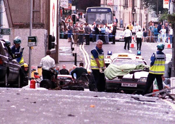 A body of one of the 21 dead is removed from the scene of the Omagh Bomb in 2005. Photo: Pacemaker