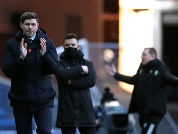 Rangers manager Steven Gerrard and Celtic manager Neil Lennon react after the final whistle