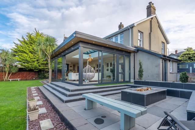 The outdoor entertainment area complete with a permanent firepit and seating area ideal for entertaining guests