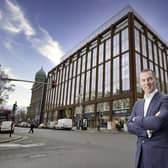 Ray Hutchinson, Managing Director of Gilbert-Ash, stands in front of Merchant Square