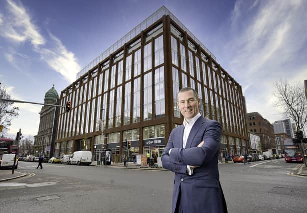 Ray Hutchinson, Managing Director of Gilbert-Ash, stands in front of Merchant Square