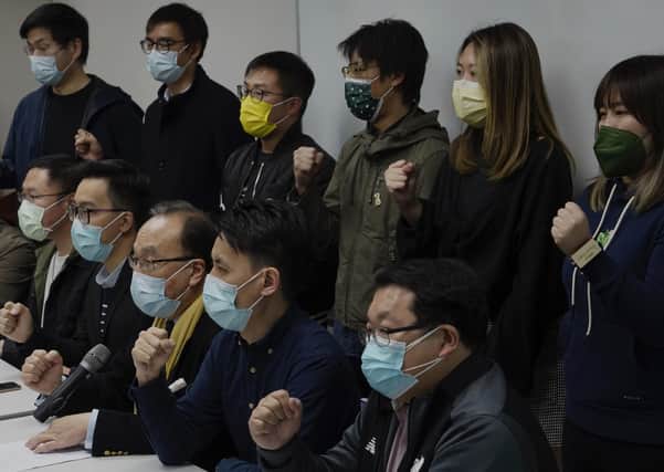 Pro-democratic party members shout slogans in response to the mass arrests during a press conference in Hong Kong yesterday, Wednesday, Jan. 6, 2021. About 50 Hong Kong pro-democracy figures were arrested by police on Wednesday under a national security law (AP Photo/Vincent Yu)