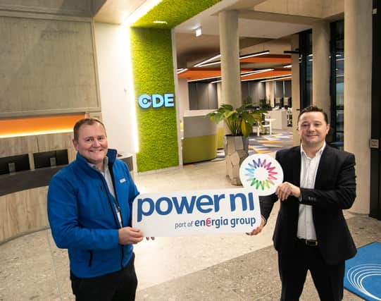 Pictured at CDE Global’s Centre of Excellence in Cookstown, Gerard Smith, Operational Excellence Manager, and Ian Fraser, Key Account Manager at Power NI, mark their new Green Energy partnership