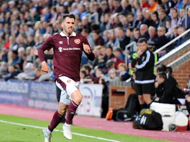 Northern Ireland defender Michael Smith has agreed a new contract with Hearts