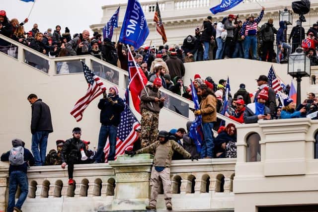 Pro-Trump supporters storm the U.S. Capitol following a rally with President Donald Trump on January 6, 2021 in Washington, DC. (Photo by Samuel Corum/Getty Images)