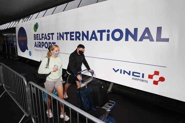 Travellers on their way to Turkey arriving at Belfast International Airport for their flight.