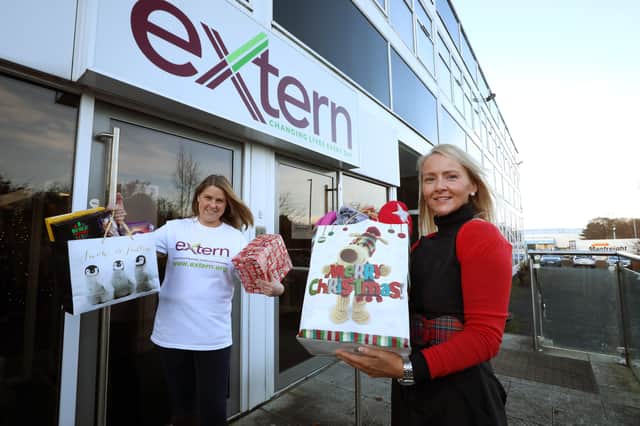 Grace O’Neill, Fundraising Manager at Extern and Claire McLernon from Danske Bank’s contact centre pictured as Claire dropped off some of the essential items donated by Danske Bank staff before Christmas to help local families in need