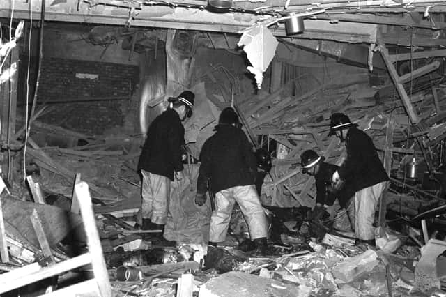 Firemen at work following the bomb attacks in Birmingham city centre that targeted the Mulberry Bush pub and the Tavern in the Town.