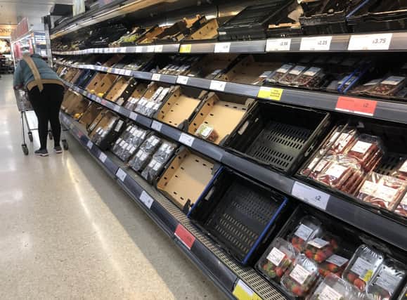 Empty shelves at the Sainsbury's store at the Forestside shopping centre in Belfast