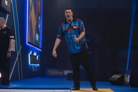 Daryl Gurney in action against eventual world champions, Gerwyn Price at the PDC World Darts Championships quarter-finals at Alexandra Palace.