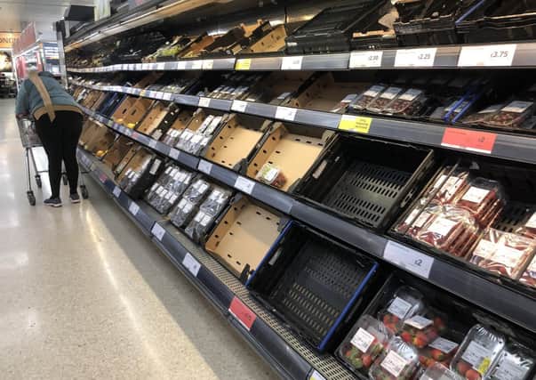 Depleted shelves in Sainsbury's at the Forestside shopping centre in Belfast