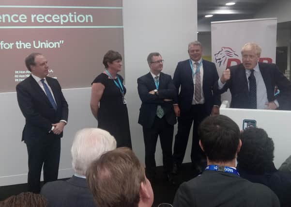 DUP leaders Nigel Dodds, Arlene Foster and Jeffrey Donaldson with Boris Johnson at a DUP reception at the Conservative Party conference on October 1 2019, the day before the party agreed a regulatory border in the Irish Sea