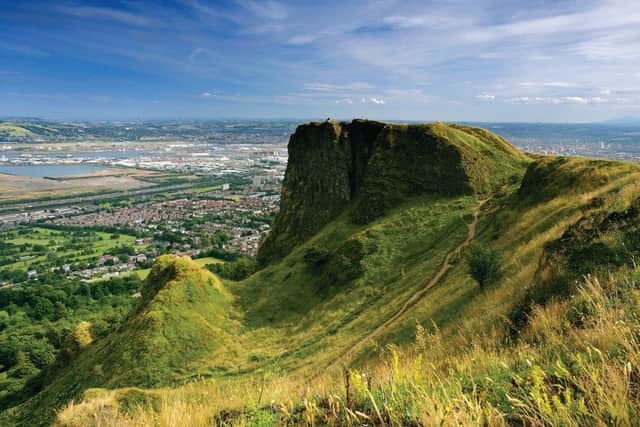 Cavehill with Belfast in the background. The centenary is a time to promote flourishing business successes, the rugged beauty of our homeland and the allure of Northern Ireland attractions