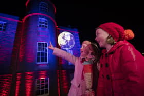 Twins Erin and Miriam, 7, take in the lights at Armagh Observatory and Planetarium