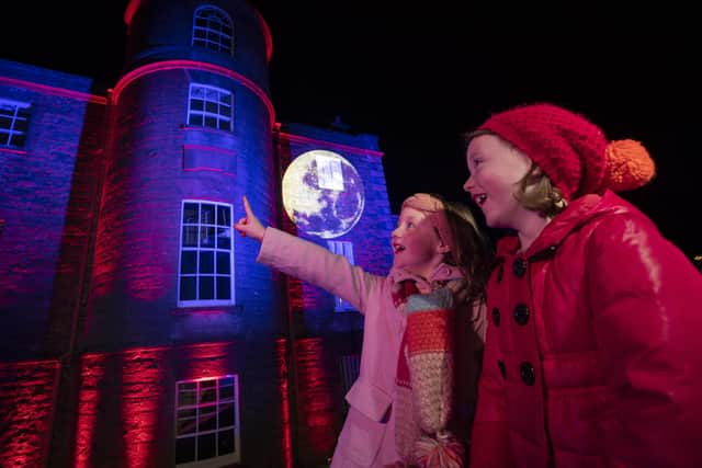Twins Erin and Miriam, 7, take in the lights at Armagh Observatory and Planetarium
