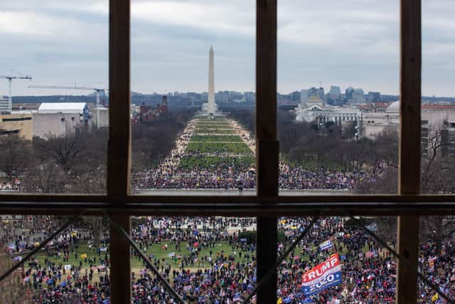 A crowd of Trump supporters gather outside Capitol Hill after a rally in Washington DC, as seen from inside the building, before it was stormed on Wednesday January 6, 2021