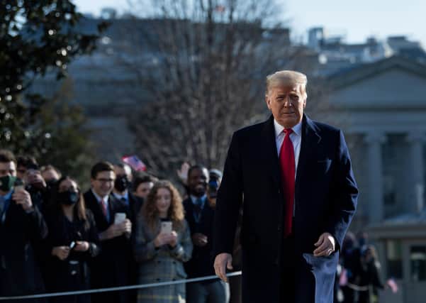 Days before the end of his presidency, Donald Trump walks by supporters outside the White House on January 12, 2021 in Washington,DC ahead of a visit to Alamo, Texas to inspect his border wall