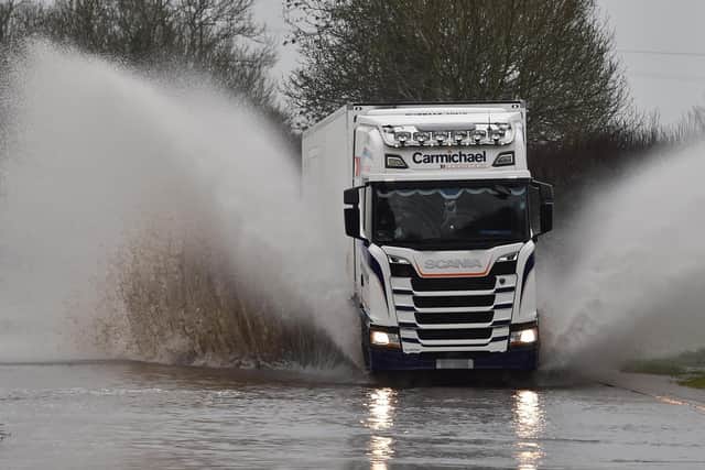 Motorists struggling threw floods on the Moira Road on Tuesday, as Storm Christoph is set to bring widespread flooding. (Photo: Colm Lenaghan/Pacemaker)
