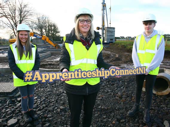 Aspiring construction apprentices Rebecca McCleary (17) and Jake Bishop (18) with Amanda Stevenson, CITB NI