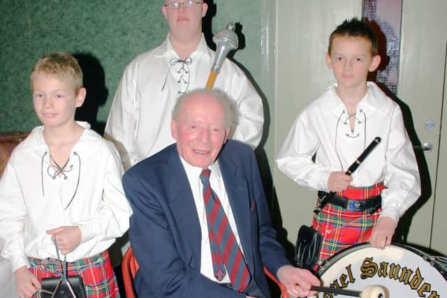 Enjoying the opportunity to join in with some of the younger members of the Colonel Saunderson Corps of Drums and Pipes in January 2007. Pictured is prominent local businessman Andrew Kinnear who was a long serving trustee of Whiteabbey Royal British Legion. He is pictured along with Jamie Crooks, Barry Leckey and James Hollywood. Picture: Newtownabbey Times archives