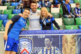 Brad Lyons with his mother Shirley and brother Mark at the 2018 Irish Cup final