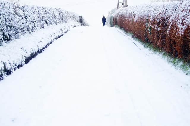 Walking in the snow on the Castlereigh Hills in east Belfast.   Picture by Jonathan Porter/PressEye