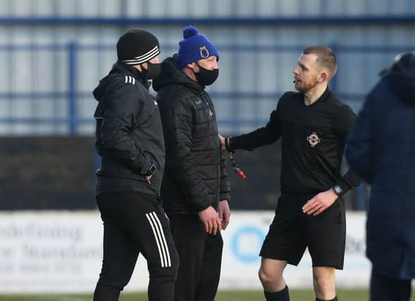 Dungannon Swifts' manager Kris Lindsay gets spoken to by the referee Tim Marshall. ©INPHO/Matt Mackey