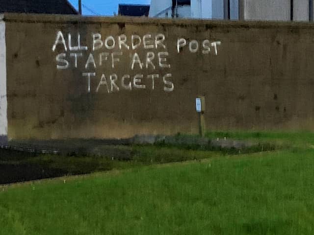 Graffiti daubed on a wall in the harbour area of Larne.