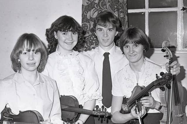 The Irish Youth Orchestra, 130 young players from Northern Ireland and Eire, made its first appearance in Belfast in January 1982 when they performed a concert at the Whitla Hall at Queen's University. Conducted by Hugh Maguire, the orchestra had previously performed in the International Festival of Youth Orchestras at Aberdeen in 1979. Pictured are violinists at the concert. They include Gillian Wishart, Coleraine, Maylis Campbell, Newry, Kieran Fitzpatrick, Belfast, and Aoibheann Doran, Londonderry. Picture: News Letter archives