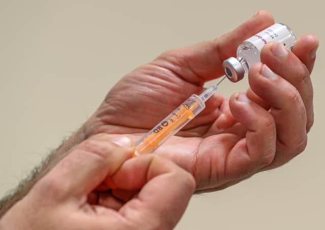 NHS staff prepare to administer a Oxford/AstraZeneca Covid-19 vaccine. In Northern Ireland, those in the 65-69 year old age category are being offered Pfizer/BioNTech vaccines