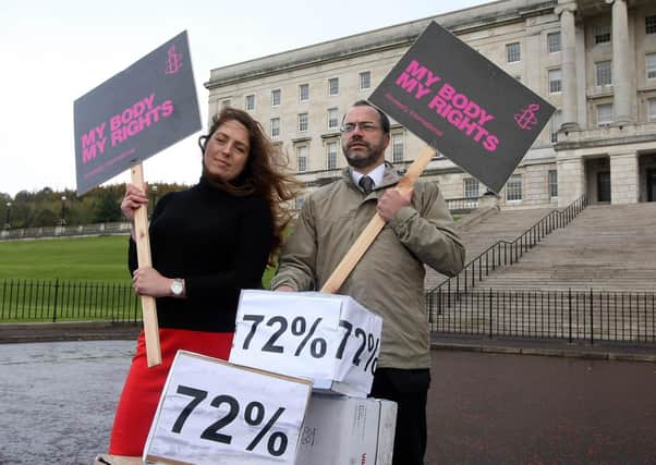 Pro abortion campaigner Adrianne Peltz and Patrick Corrigan of Amnesty International handing a 45,000-name petition - calling for abortion law reform in NI - in to Stormont in October 2016. Picture: Freddie Parkinson/Press Eye