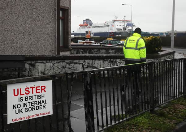 An anti-Irish Sea border sign near the entrance to Larne Port. Photo: Brian Lawless/PA Wire