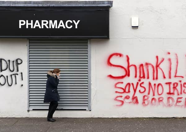 Anti-Irish Sea border and anti-DUP graffiti has been appearing across Northern Ireland – along with more sinister messages. Photo: Charles McQuillan/Getty