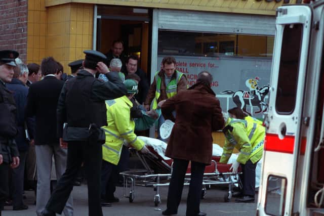 Scenes on the Ormeau Road in February 1992 after two UDA gunmen opened fire and killed five people. Photo: Pacemaker