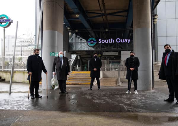 Members of the service for the 25th anniversary memorial service of the London Docklands bombing yesterday at the spot where two people died in the IRA blast in February 1996. Picture: Aaron Chown/PA Wire
