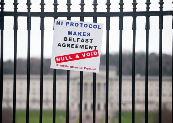 A poster opposing the protocol has appeared on the gates of Stormont. Colum Eastwood says that the future of the assembly there is threatened by the unionist reaction to the Irish Sea border