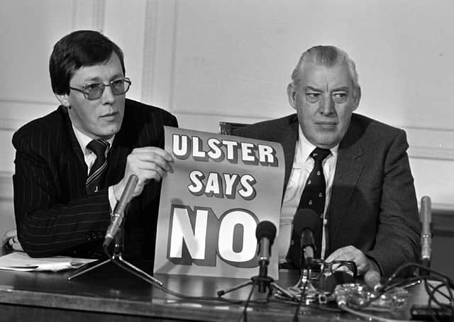 Peter Robinson with Ian Paisley in 1985 after the Anglo Irish Agreement. Mr Robinson is a shrewd tactician with a memory of loyalist and unionist campaign successes and failures.