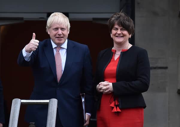 Boris Johnson and Arlene Foster at Stormont on its return, in January 2020. Mrs Foster and her party are fiercely criticising his Irish Sea border yet as recently as last month she described it as a "gateway of opportunity". A DUP minister's department built it, the DUP voted to ban British soil from NI, and the DUP in 2019 agreed to a regulatory border